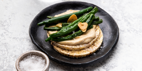 Hommus, & pan-fried garlic beans on Corn Thins slices