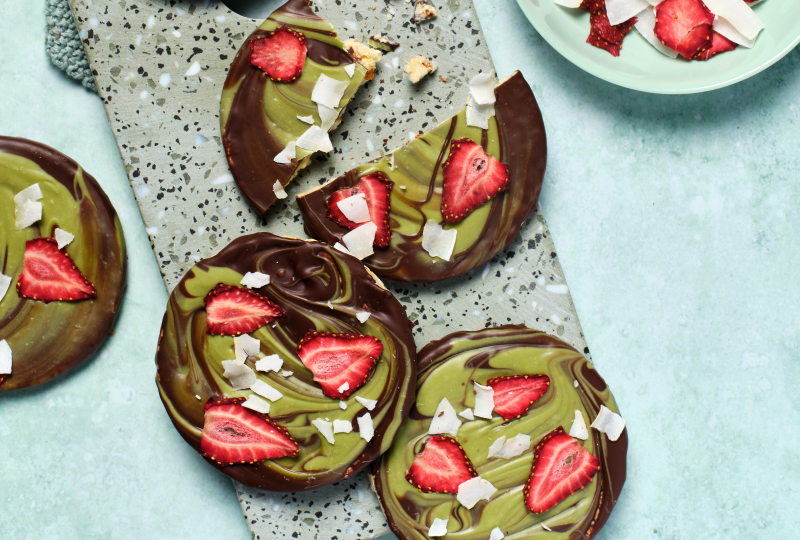 Dark Choc, Matcha White Choc, Dehydrated Strawberry and Coconut on Corn Thins slices