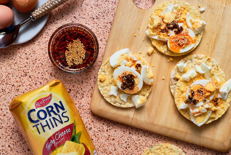 Hard Boiled Egg & Crispy Chilli Oil on Corn Thins slices
