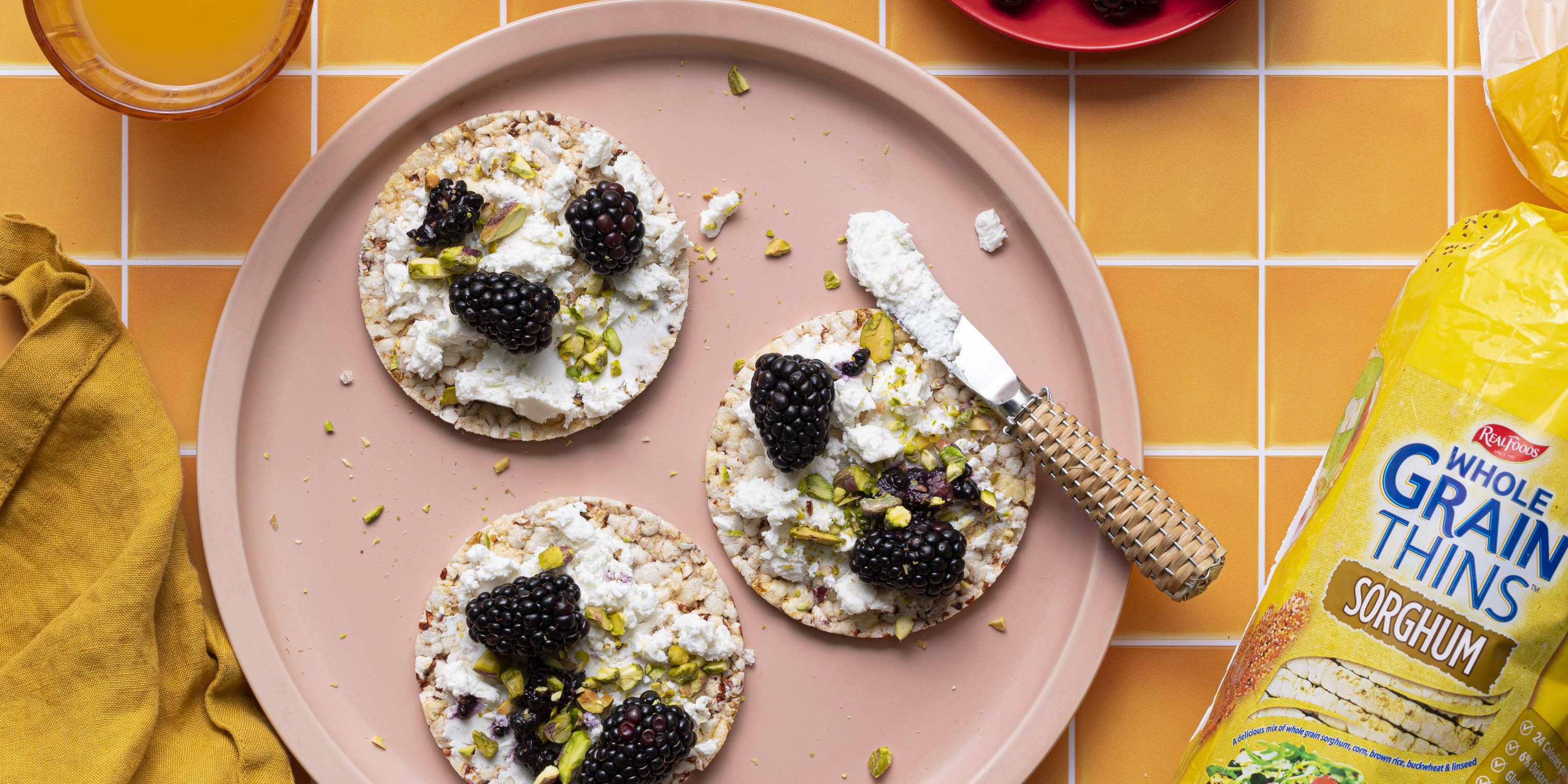 goat cheese, blackberry, pistachio on Corn Thins slices