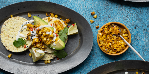 avocado wedges, grilled corn, caesar dressing & chilli on Corn Thins slices
