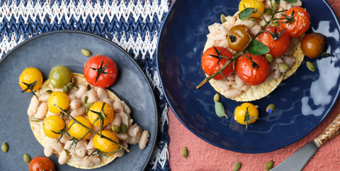 smashed white bean, roast cherry tomato, pepita & oregano on Corn Thins slices