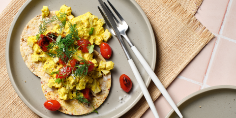 Tofu scramble with tomato on Corn Thins slices